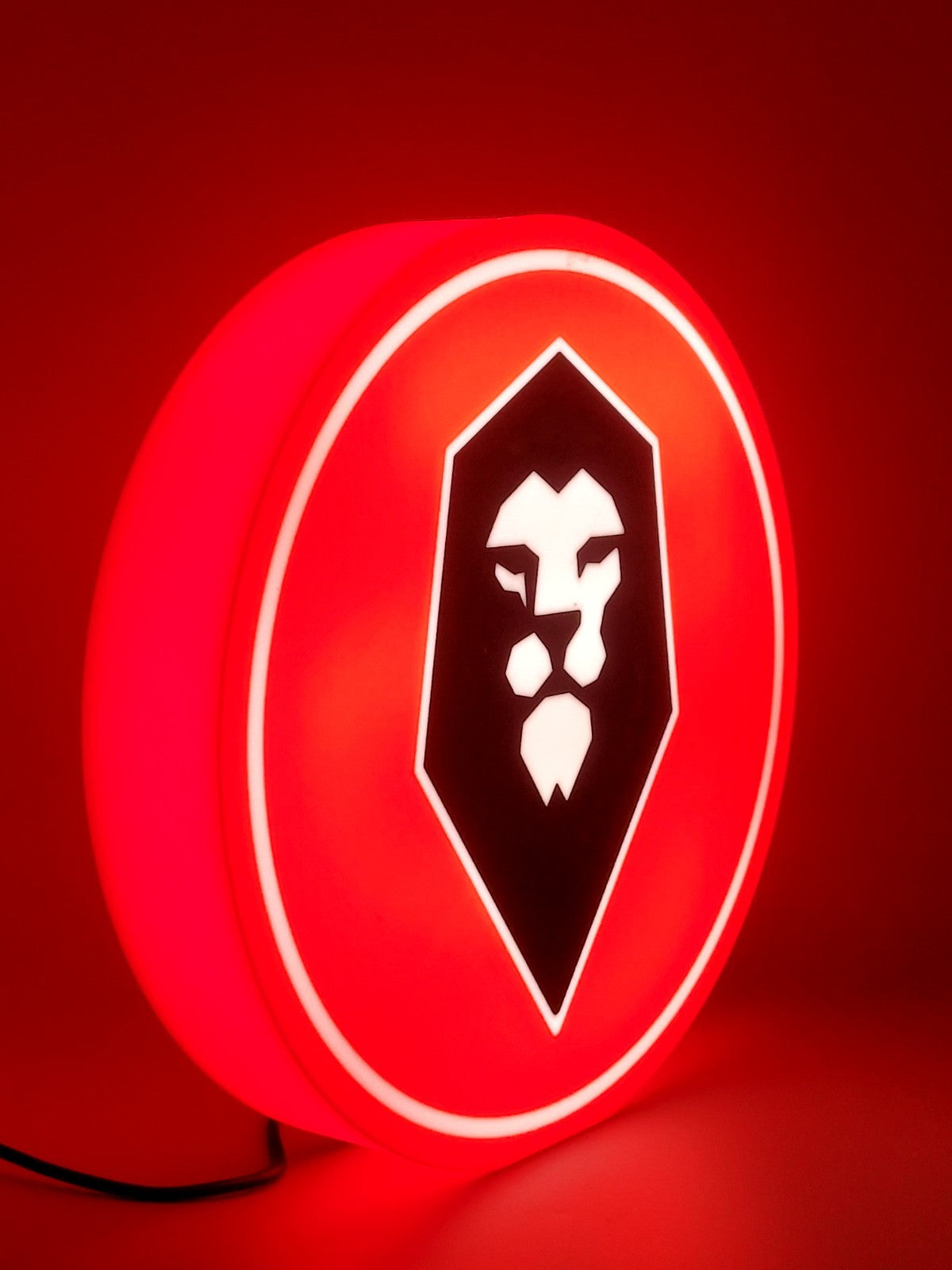 Salford FC led light sign with illuminated logo viewed from side view