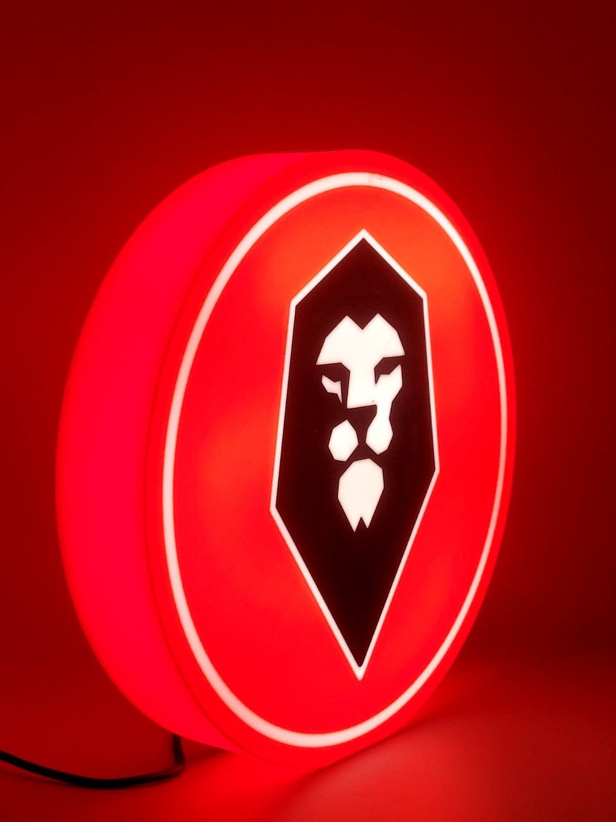 Salford FC led light sign with illuminated logo viewed from side view