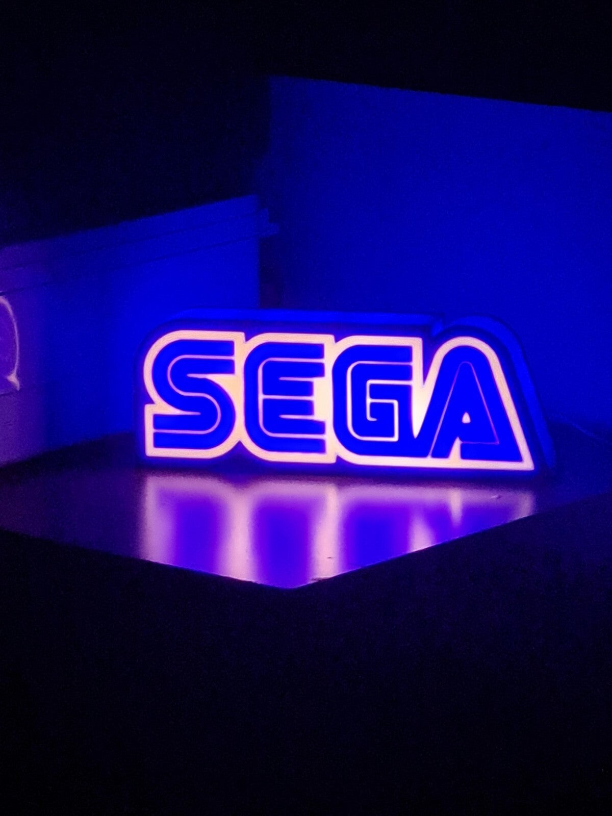 sega led light sign with illuminated logo viewed from straight on