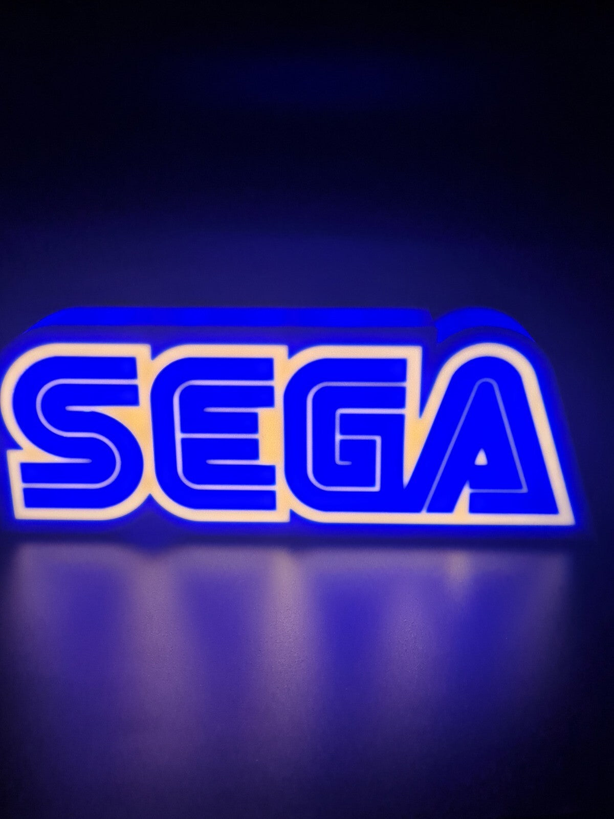 sega led light sign with illuminated logo viewed from straight on