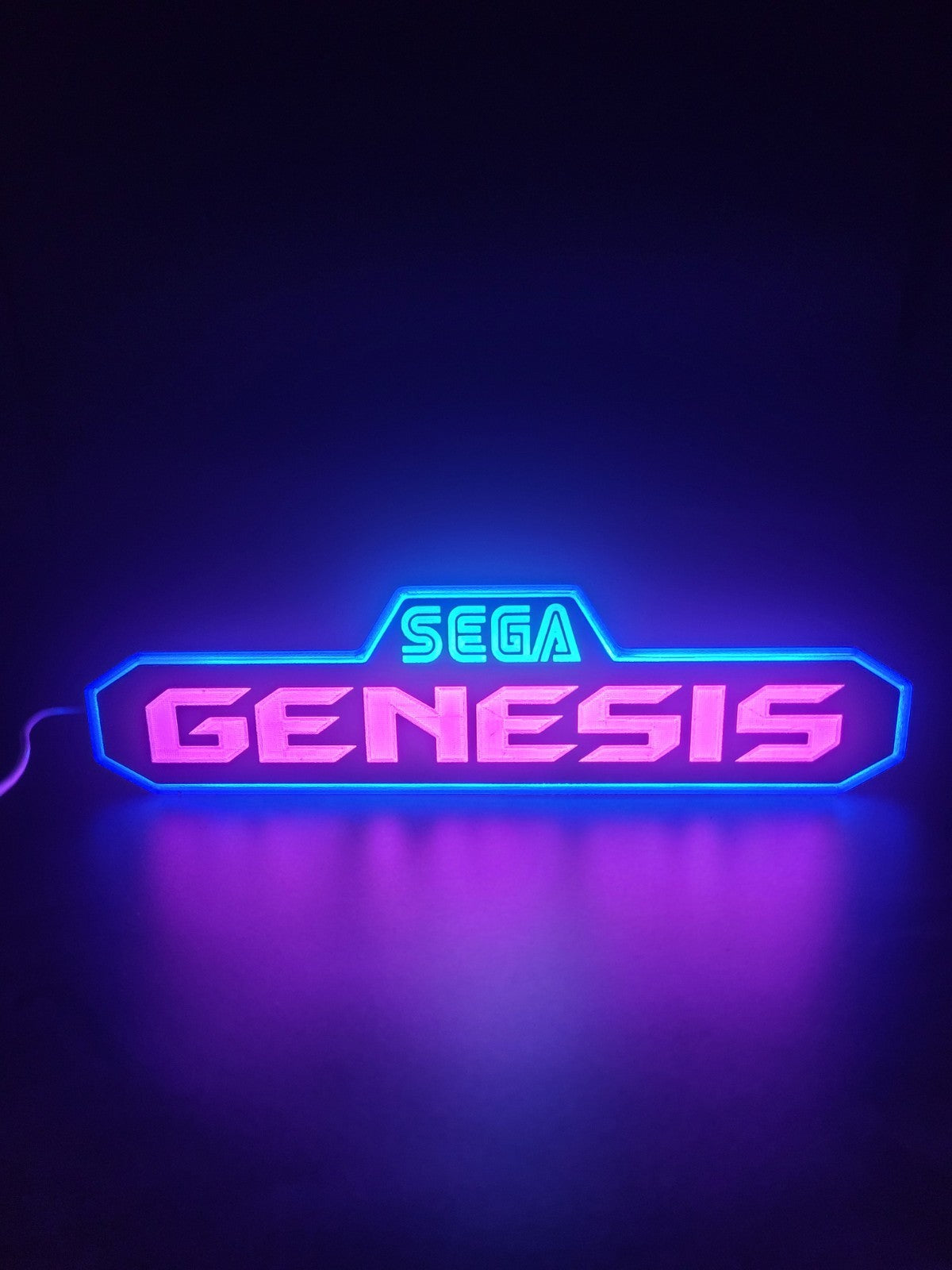 Sega genesis led light sign with illuminated logo viewed from straight on