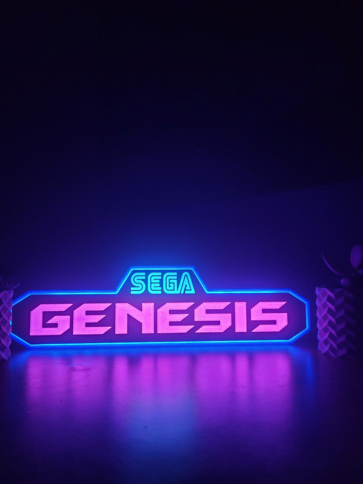 Sega genesis led light sign with illuminated logo viewed from straight on
