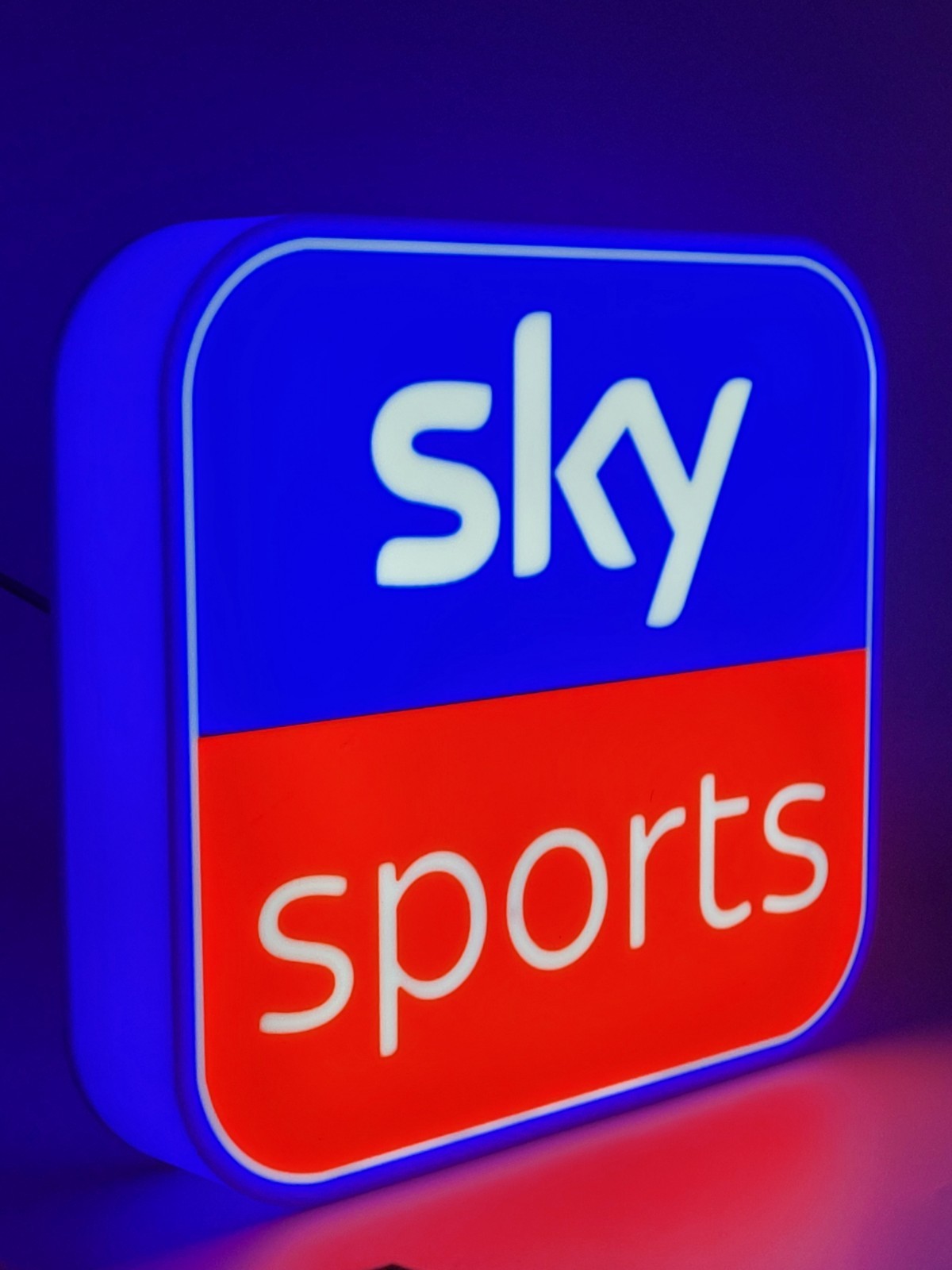 sky sports led light sign with illuminated logo viewed from side view