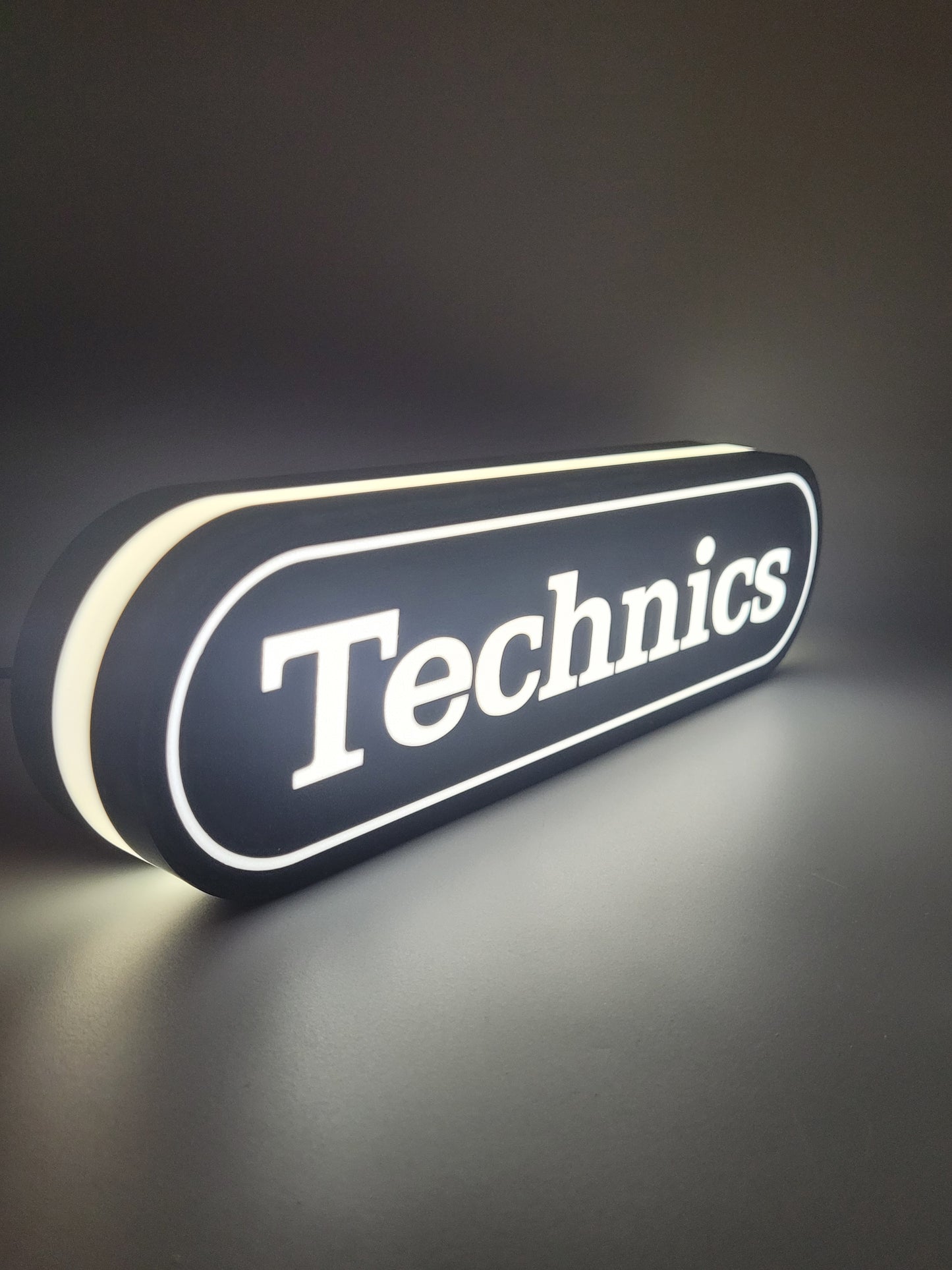technics led light sign with illuminated logo viewed from side view