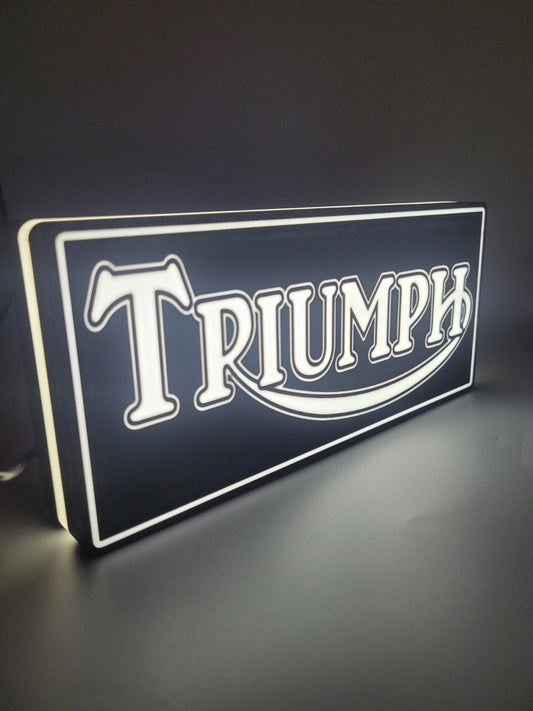 TRIUMPH LED light sign with illuminated logo viewed from side view