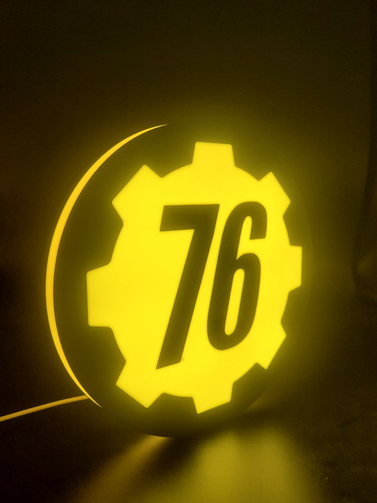 Vault 76 LED light sign with illuminated logo viewed from side view