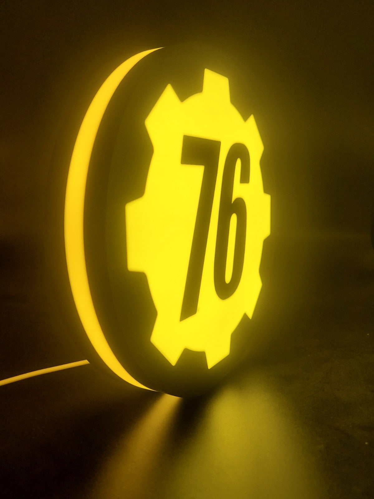 Vault 76 LED light sign with illuminated logo viewed from side view