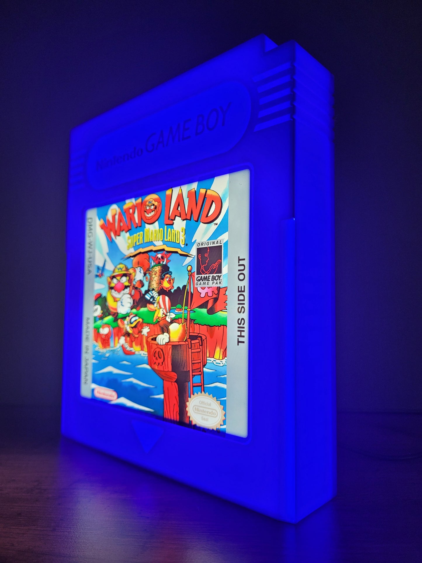 wario land giant cartridge led light sign with illuminated logo viewed from side view