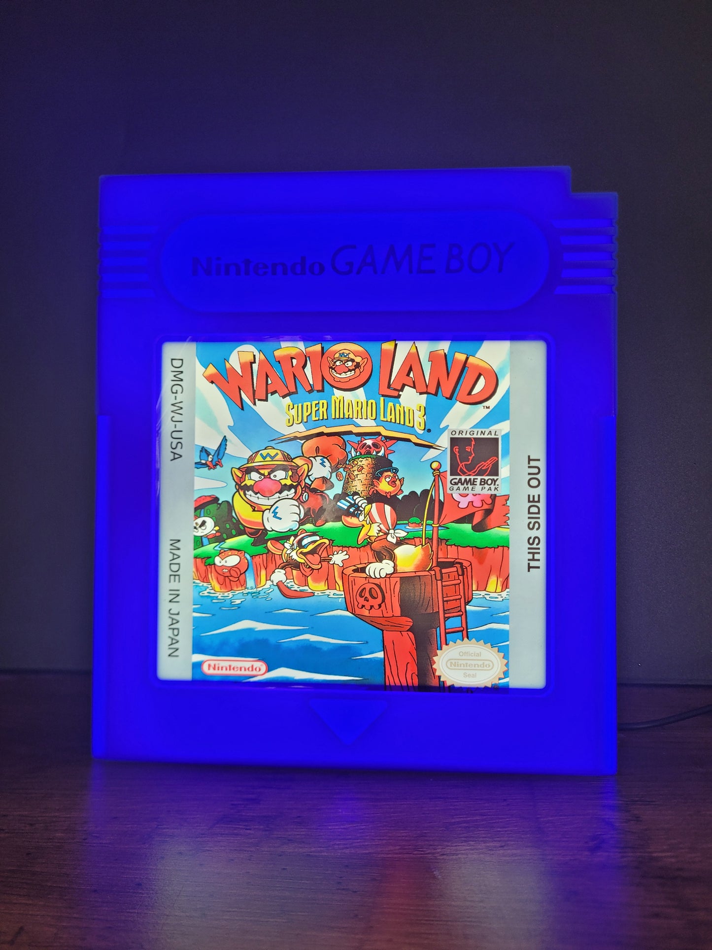 Wario Land GAMEBOY CARTRIDGE LED light sign with illuminated logo viewed from straight on