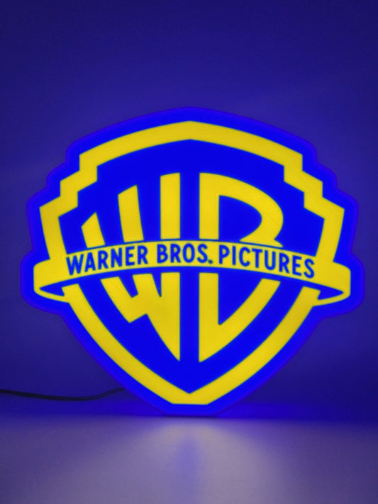 Warner Bros led light sign with illuminated logo viewed from straight on