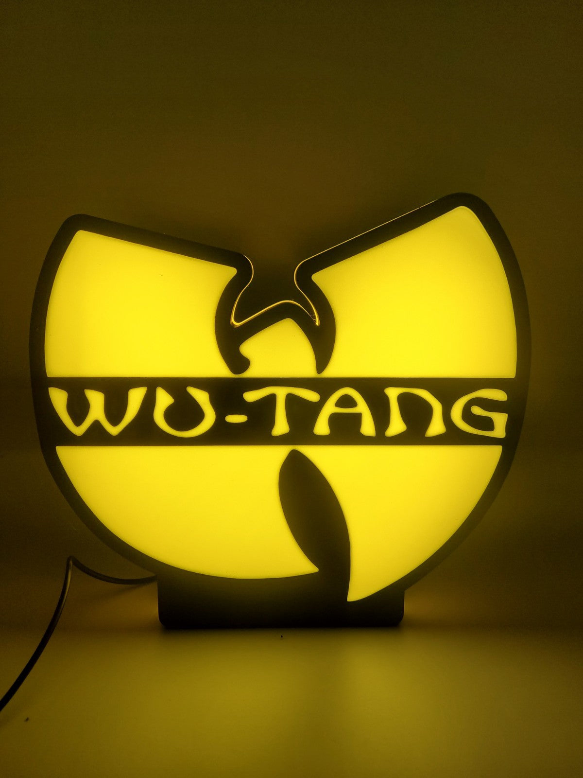 WU-TANG led light sign with illuminated logo viewed from straight on